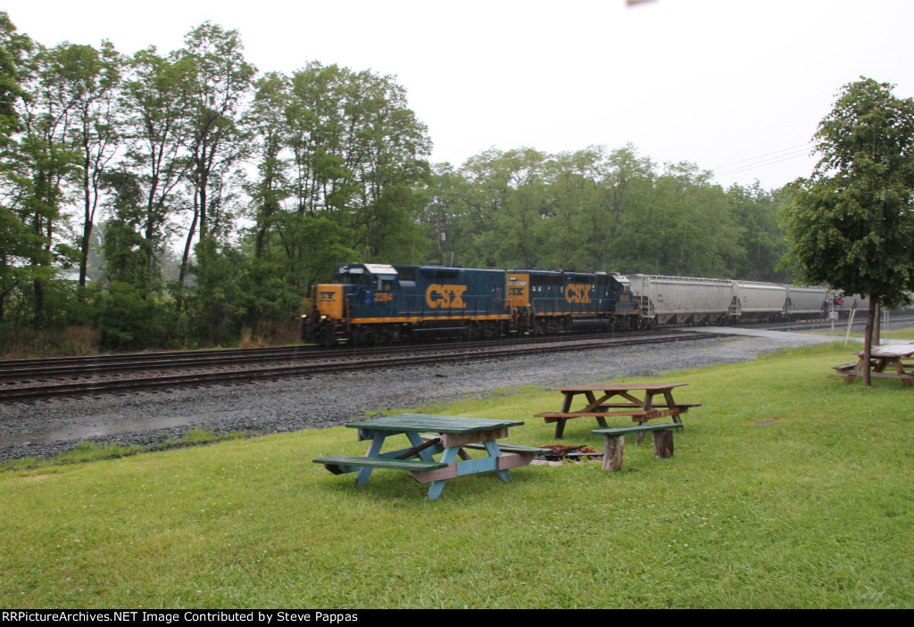 A CSX local train comes through Westfield NY in the rain